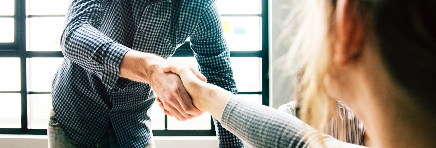 Photograph of two people shaking hands